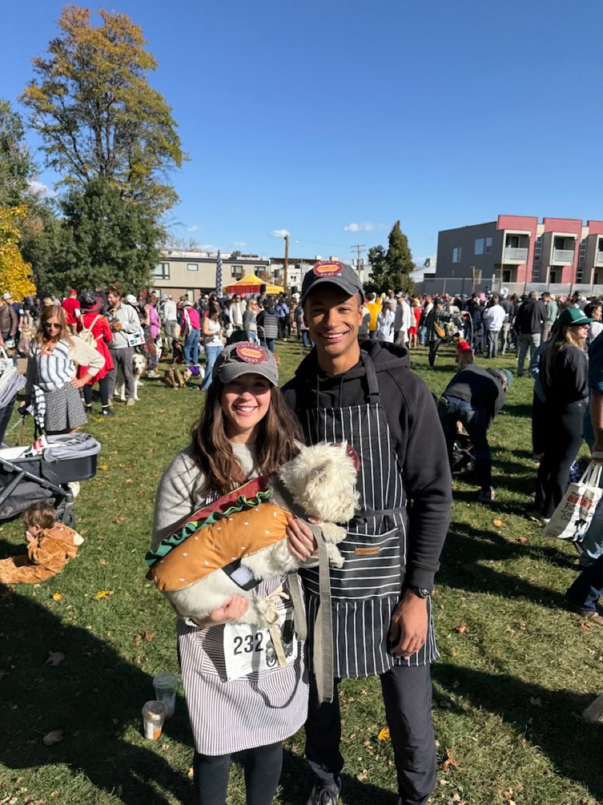 Quest and Quinn dressed as hot dog vendors with Elton